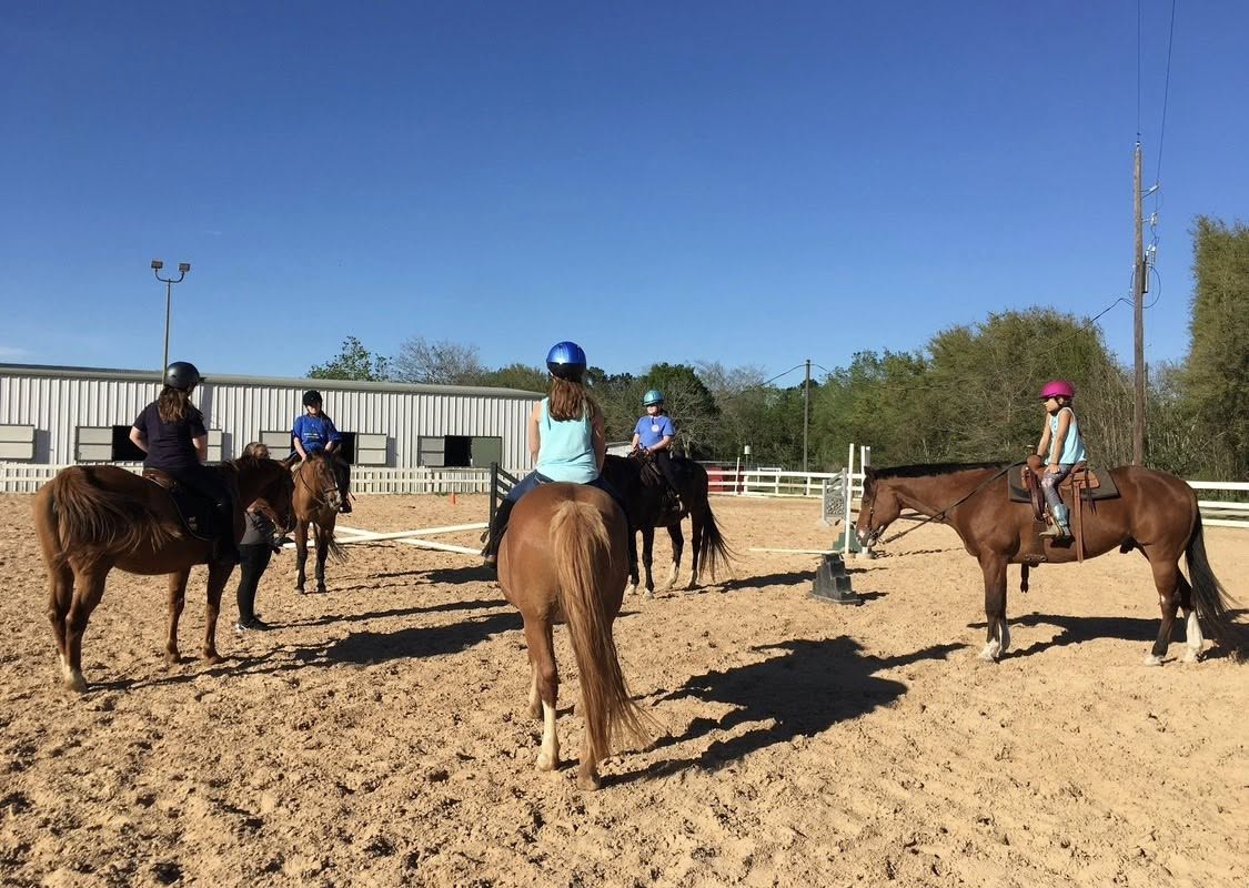 Outdoor group riding lesson for beginners at Circle Lake Ranch